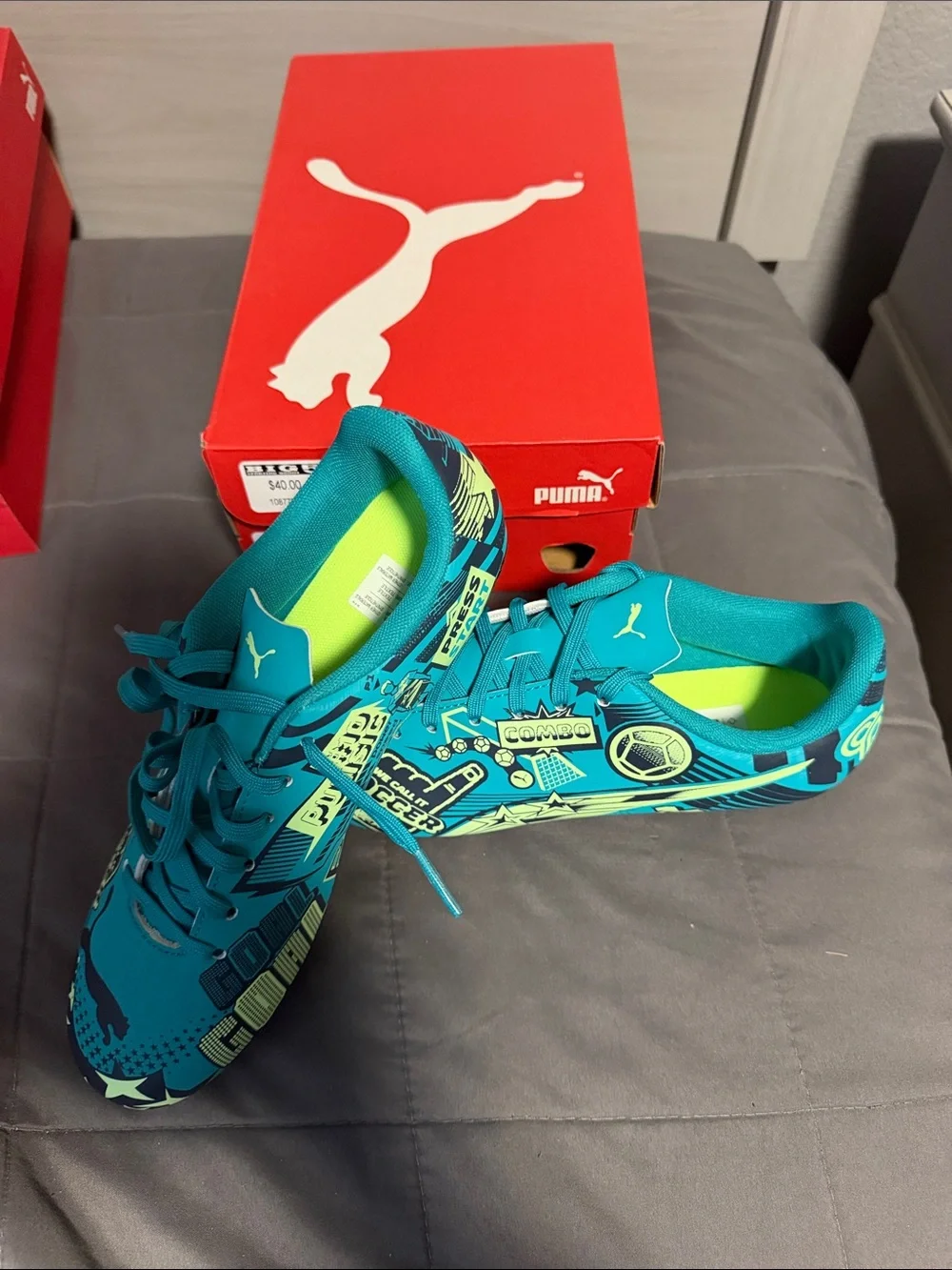 Puma Men’s Teal and Neon Yellow Graphic Soccer Shoes (JINIOR)